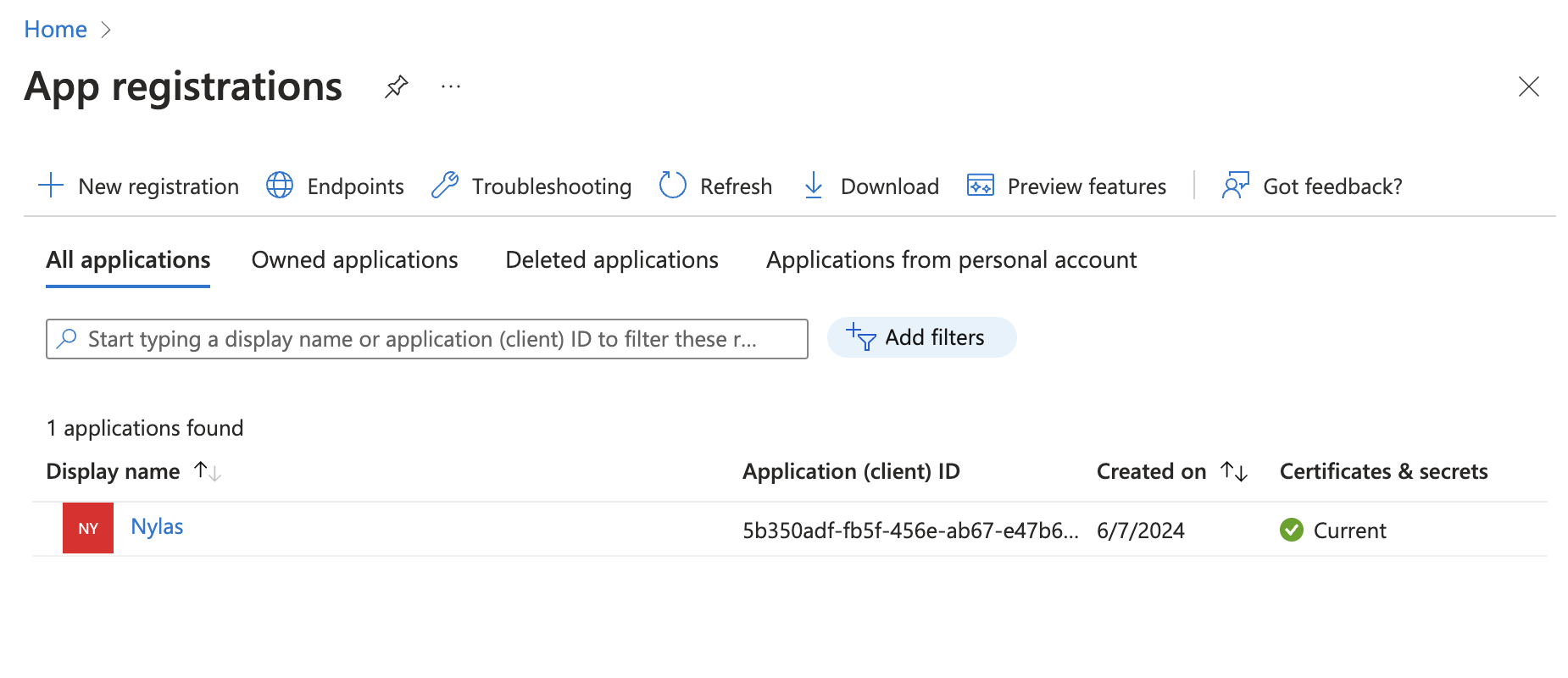 The Microsoft Azure Portal showing the "App registrations" page. One application is listed, along with its client ID.